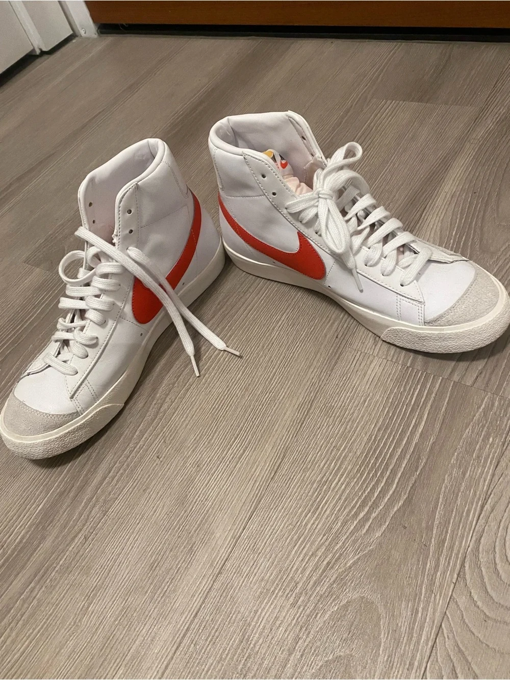 Nike White High-Top Sneakers with Red Swoosh Accent